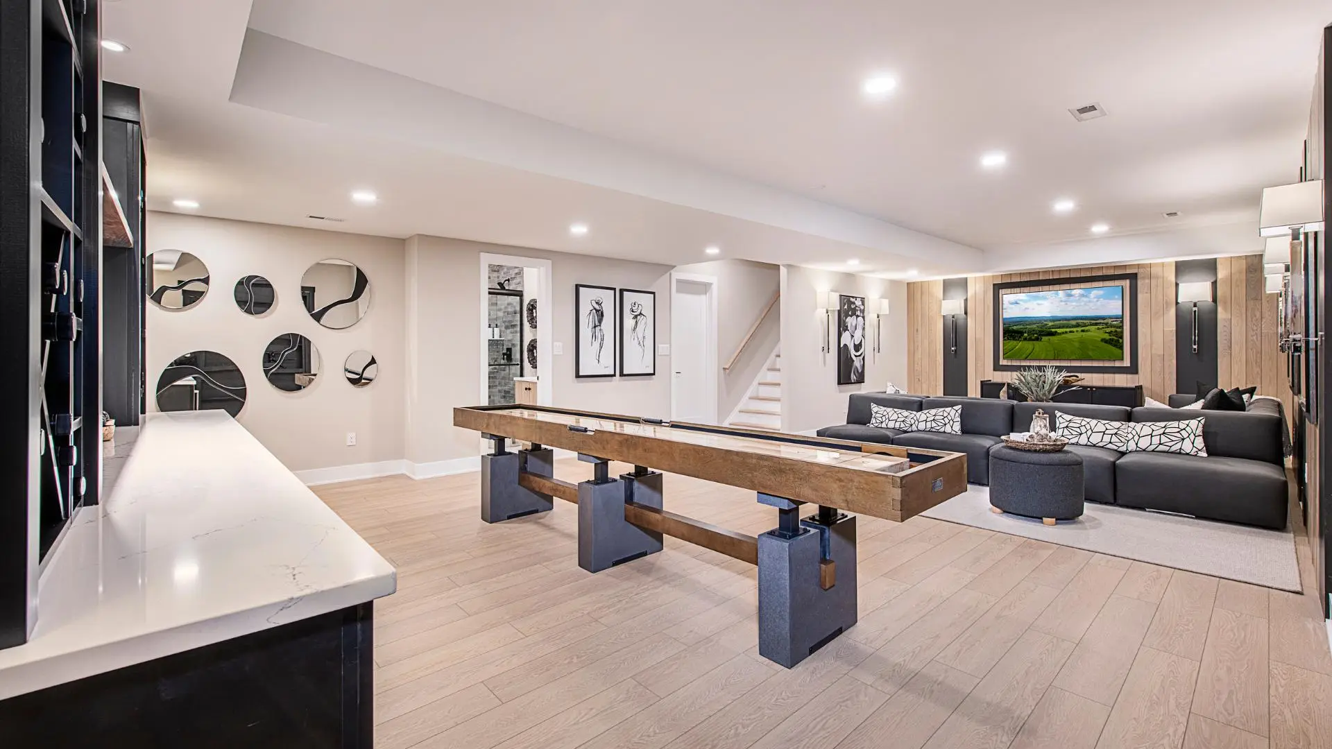 Finished basement with entertainment wall